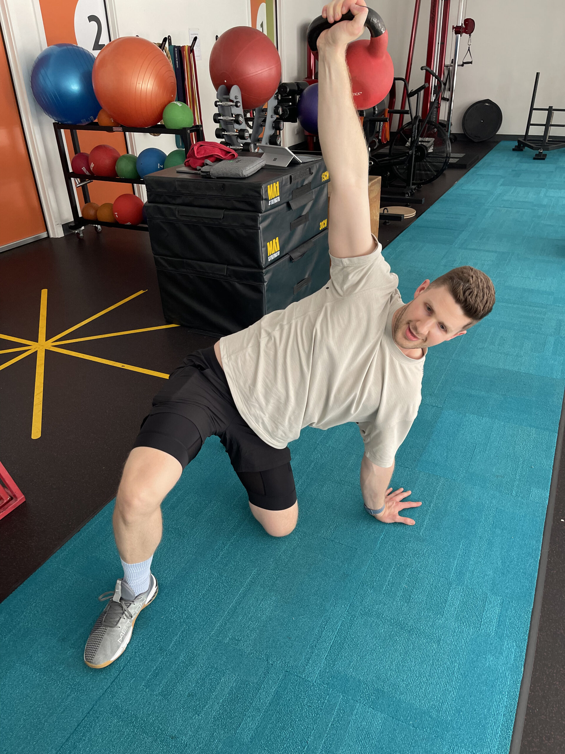 A man exercising as part of a sports physio program in Adelaide