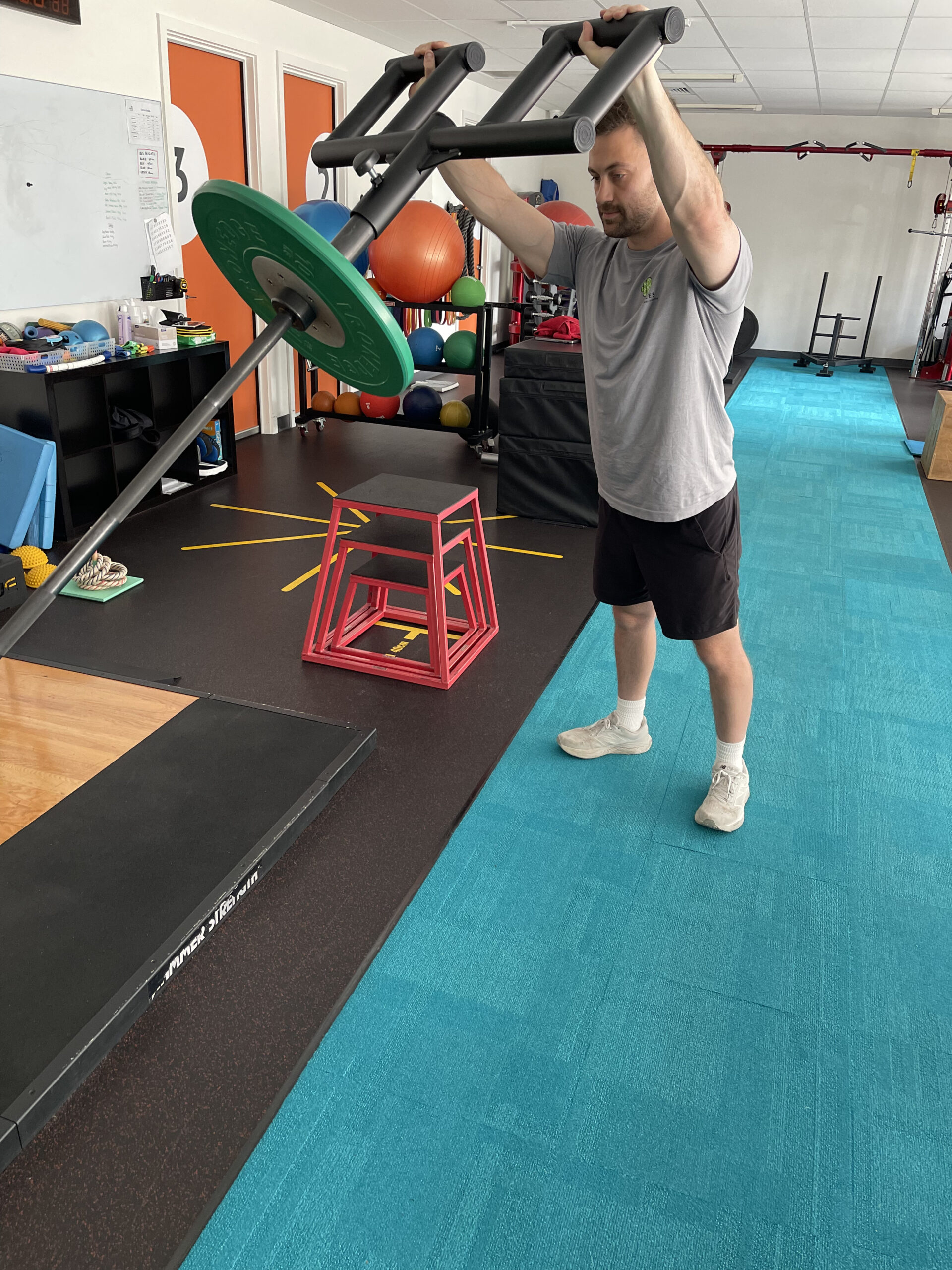 An athlete using gym equipment during a sports physio session in Adelaide