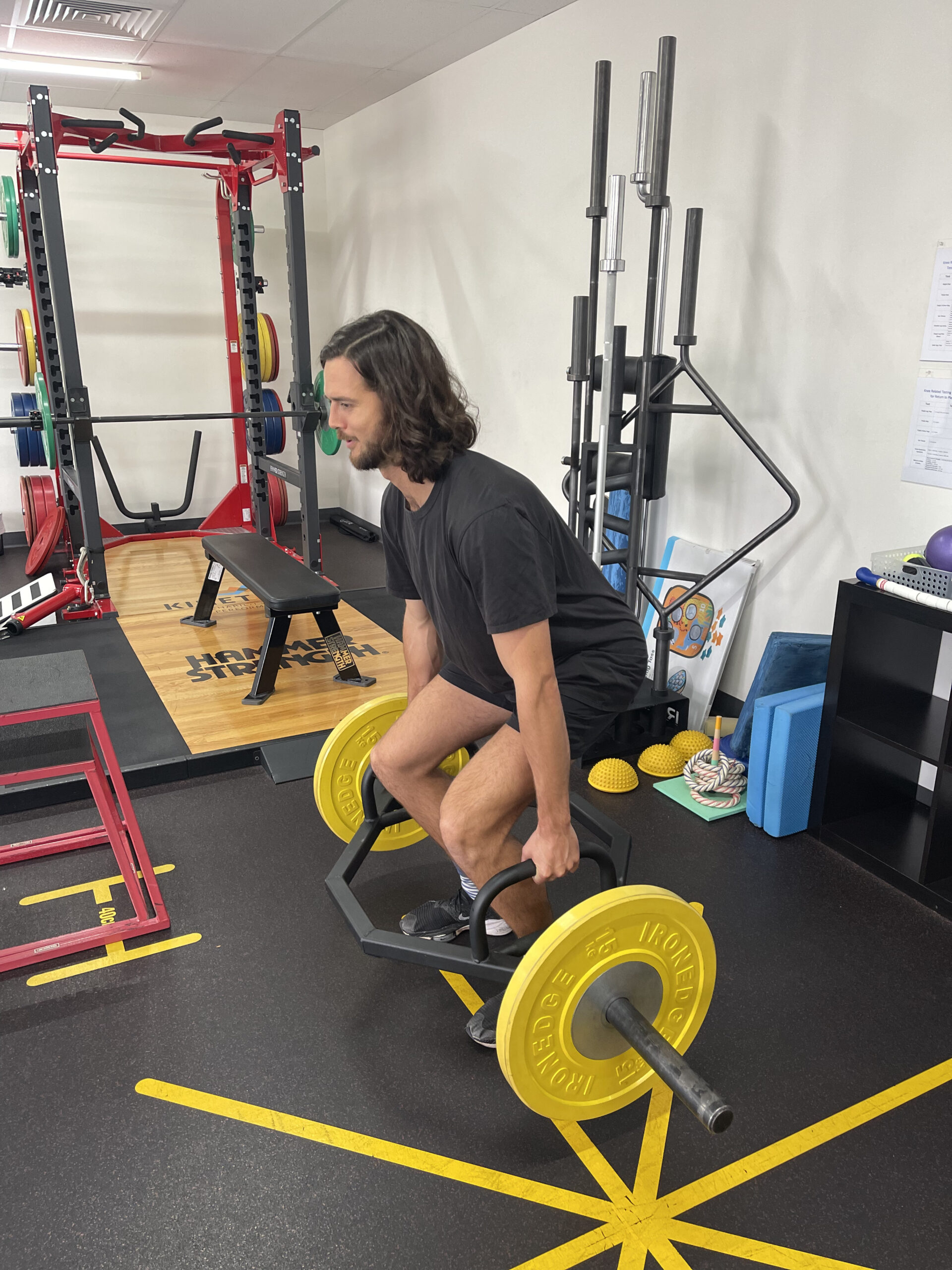 A sports physio patient in Adelaide performing rehabilitation exercises