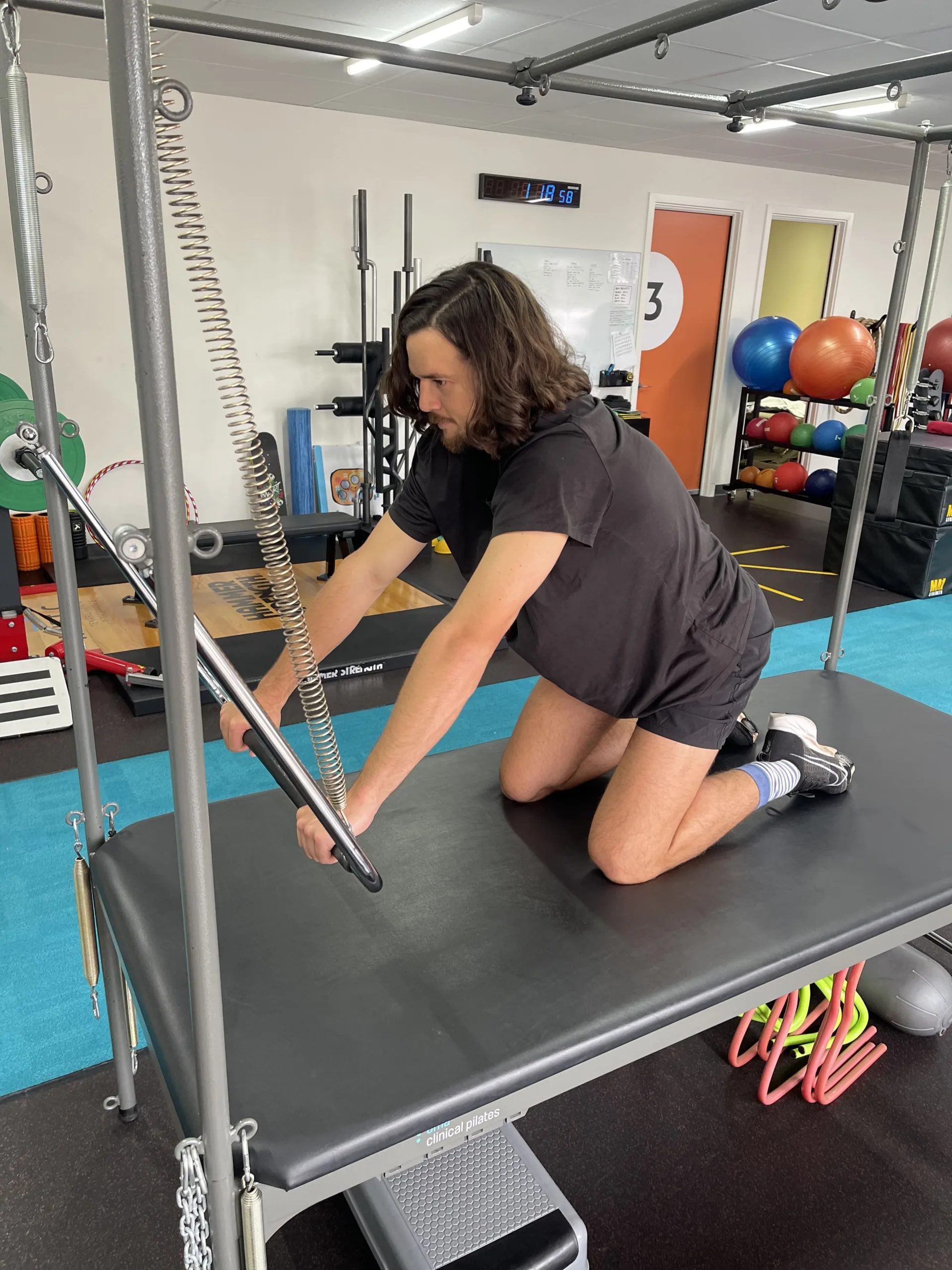 Clinical Pilates physio session focusing on rehabilitation, health, and controlled movement
